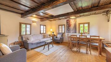 Family Chalet, Multiple Bedrooms, 2 Bathrooms (Mimi Cottage near Kolpa River) | Living area | 21-inch flat-screen TV with cable channels