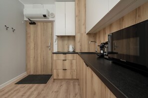 Apartment, 1 Bedroom, Balcony | Private kitchen | Microwave, coffee/tea maker, electric kettle, toaster - Grey and Beige Apartment by Renters (Wroclaw)