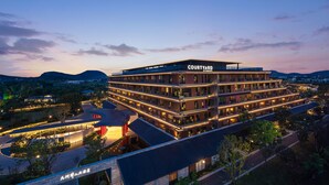 A multi-story hotel with a modern design, featuring a prominent 'Courtyard' sign. - Courtyard by Marriott Changzhou China (Changzhou)