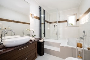 Shower, hair dryer, towels, soap