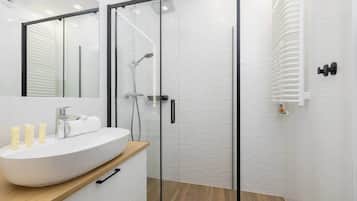 Shower, hair dryer, towels, shampoo