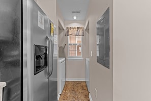 Enjoy a convenient stay with a refrigerator, microwave, and water dispenser in this compact room.