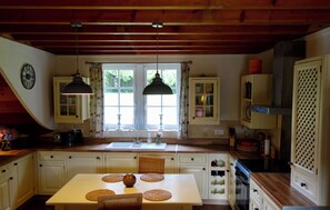 Microwave, oven, dishwasher, dining tables