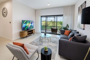 Luxury Apartment, Mountain View | Living area | 32-inch Smart TV with cable channels - The Luxury Verdant Garden Hotel  (Quatre Bornes)