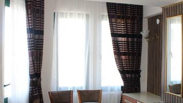 Desk, laptop workspace, free WiFi, bed sheets