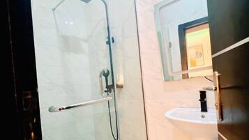 Deluxe Apartment, City View | Bathroom | Separate bathtub and shower, towels, soap, shampoo
