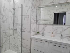 Shower, hair dryer, towels, soap