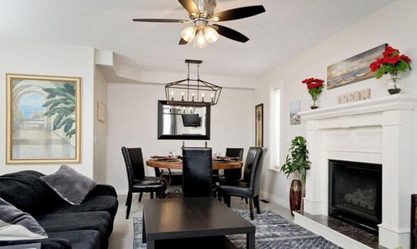 TV, fireplace, video games, ping pong - Arbour Lake 3BR2BA Family Retreat w/ Hot Tub, Games Room, BBQ, Yard C-Air — Sleeps 8 (Calgary)