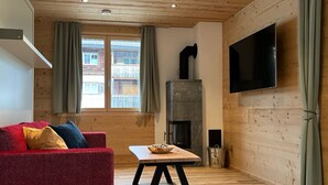 Living area - New vacation apartment in the middle of the SkiArena Andermatt Sedrun with indoor golf course (Camischolas)