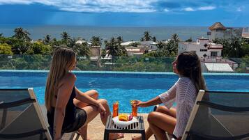 Outdoor pool, open 8:00 AM to 10:00 PM, free pool cabanas
