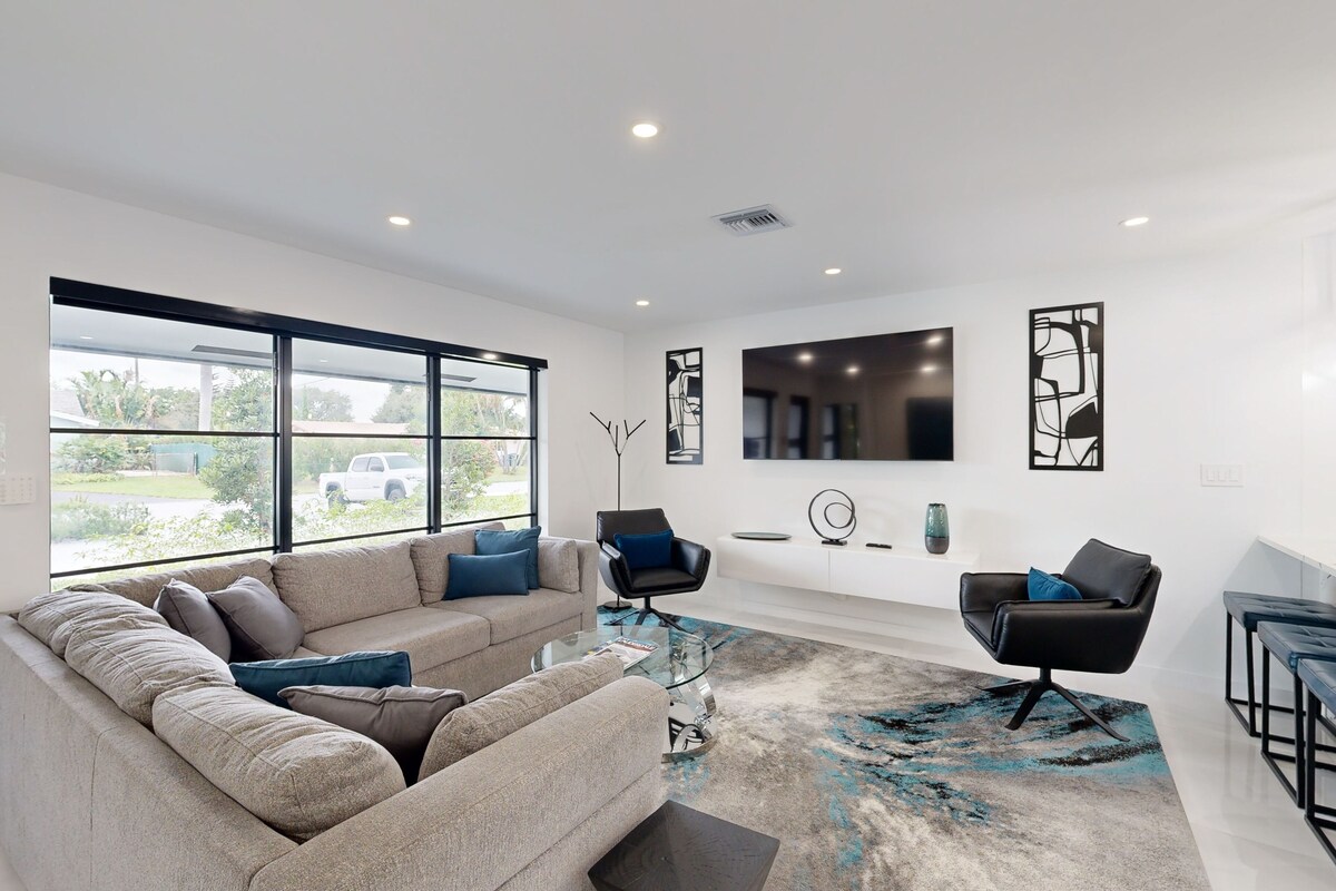 Stunning single level home with, heated pool, kitchen, & fully equipped BBQ area