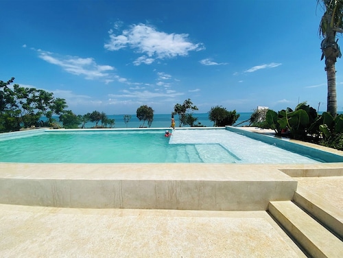 Charming Zanzibar suites with ocean views and modern amenities. 