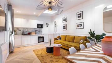 Family Apartment, Balcony (15) | Living area | 60-inch TV with cable channels