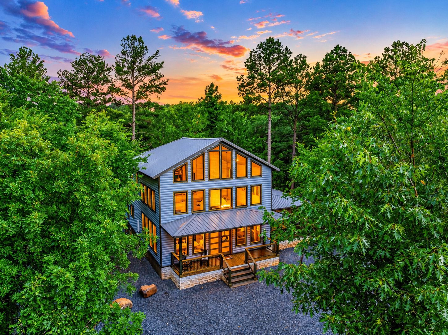 Exterior Oasis: Stunning architecture with vibrant sunset views amid lush greenery awaits you!