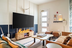 4 Bedrooms Bachelor Suite | Living area | 50-inch Smart TV with digital channels, Netflix, Hulu