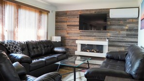 TV, fireplace, books