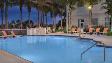 Outdoor pool, open 9:00 AM to 10:00 PM, pool umbrellas, pool loungers
