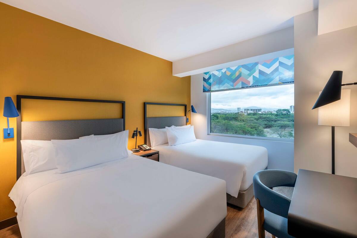 Hypo-allergenic bedding available, down comforters, in-room safe, desk