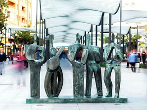 A sculpture of abstract human figures in a public square. - Sky Sea Holidays Torremolinos Nogalera (Torremolinos)