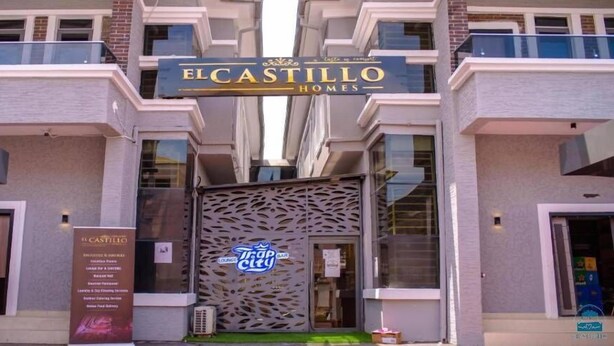 A building with a sign reading "EL CASTILLO HOMES". - El-Castillo Hotels and Suites Lekki (Lekki)