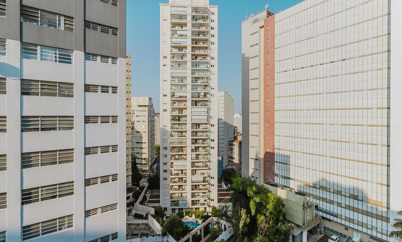 A high-rise building with multiple floors, large windows, and a modern architectural design.