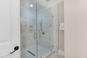 Shower, hair dryer, towels, shampoo