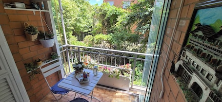 Outdoor dining. Cozy family apartment with free covered parking close to EUR business area.