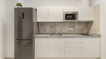 Fridge, microwave, stovetop, coffee/tea maker