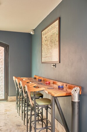 Enjoy meals in this dining area with a long table and comfortable seating for all.