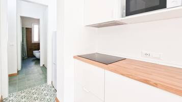 Fridge, high chair, cookware/dishes/utensils