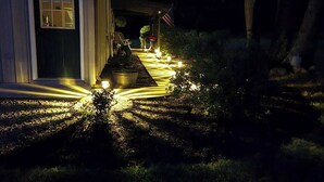 A house with a covered porch and a garden pathway lit by ground lights. - Escape to Nature – 2 Bdrm Home on 13 Private Acres near ATV, SSRT trails and PSU (Munson)