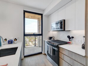 Luxury Apartment, 2 Bedrooms | Private kitchen | Full-size fridge, microwave, oven, stovetop