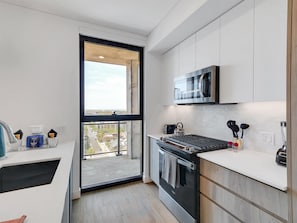 Luxury Apartment, 2 Bedrooms | Private kitchen | Full-size fridge, microwave, oven, stovetop