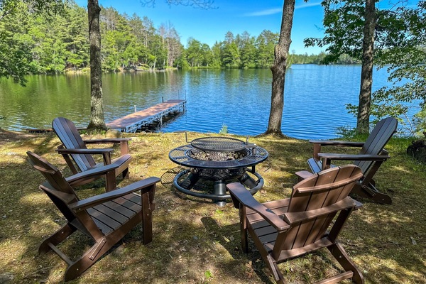 Enjoy serene evenings by Twin Bear Lake with a cozy fire pit, perfect for making s'mores and sharing stories under the stars.
