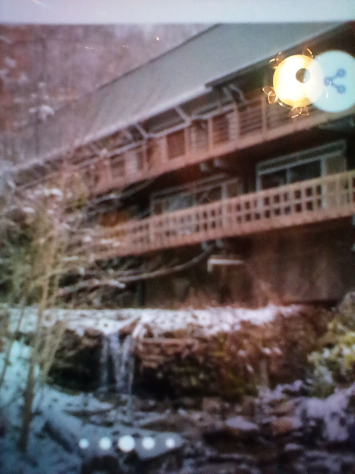 A building with multiple balconies and a waterfall.