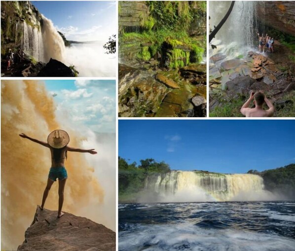 Una cascata, un paesaggio roccioso, una persona in piedi su una roccia e un fiume.