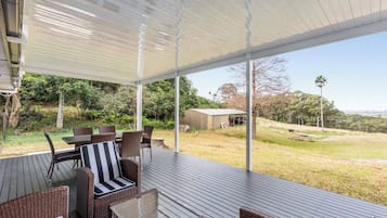 Relax on the deck with a view of the surrounding landscape.