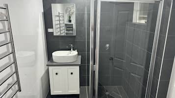 Shower, eco-friendly toiletries, hair dryer, towels