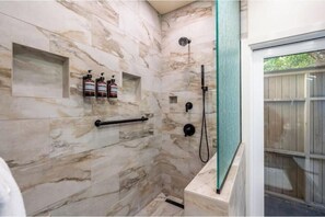 Shower, hair dryer, towels, soap