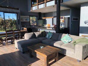 Living area - Bathed in sunshine with stunning mountain views, relax in luxury after a ski. (Lauriston)