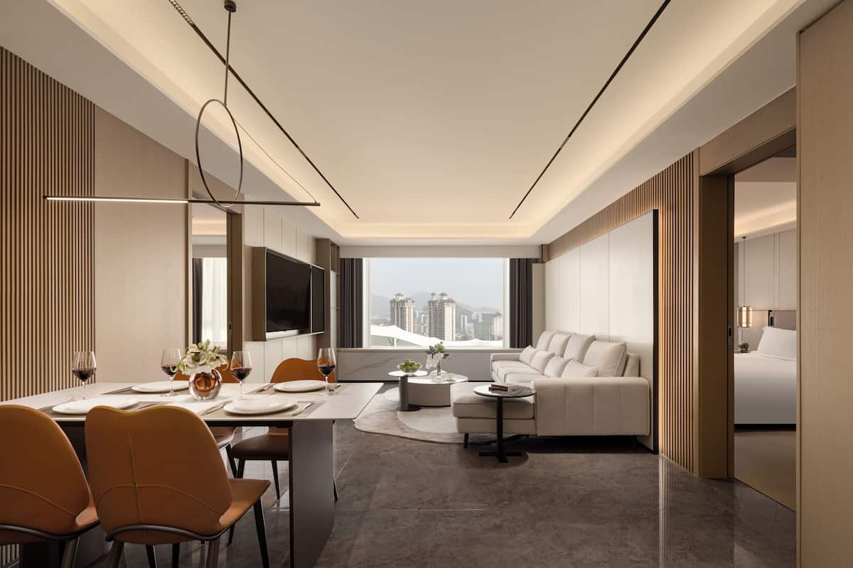 Executive Apartment, Courtyard View | Living area | 65-cm LED TV with digital channels, toys