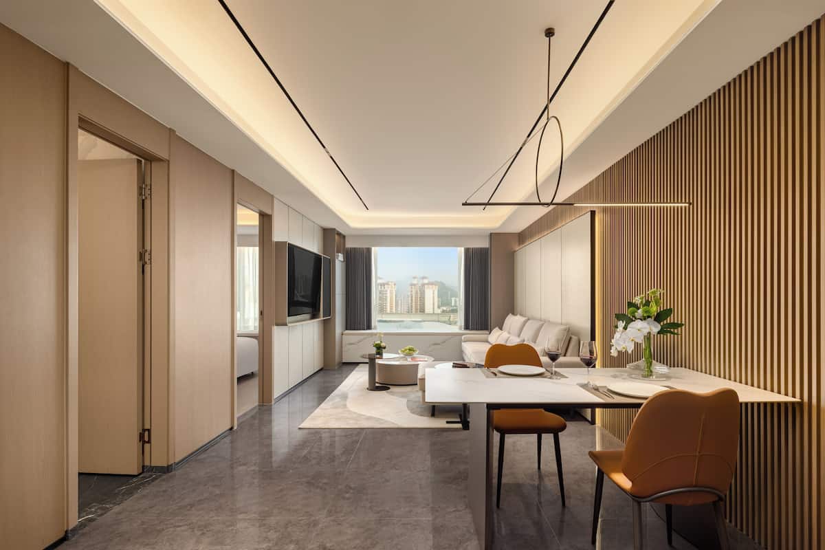 Superior Apartment, Courtyard View | Living area | 65-cm LED TV with digital channels, toys