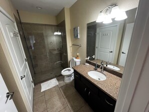Shower, hair dryer, towels, soap