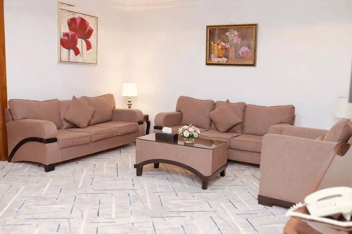 Two-Bedroom Deluxe Apartment | Living area | 40-inch Smart TV with cable channels