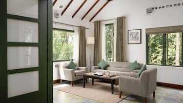 Deluxe Suite, Balcony, Garden View | Living area | 32-inch Smart TV with satellite channels