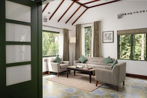 Deluxe Suite, Balcony, Garden View | Living area | 32-inch Smart TV with satellite channels