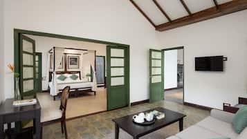 Deluxe Suite, Balcony, Garden View | Living area | 32-inch Smart TV with satellite channels