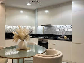 Deluxe Apartment, Balcony, City View | Private kitchen | Fridge, microwave, oven, stovetop
