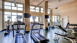 A gym with treadmills, stationary bikes, and weight machines. - Grand Panama 1801! Sunset Views, Corner Unit, Pets OK (Panama City Beach)