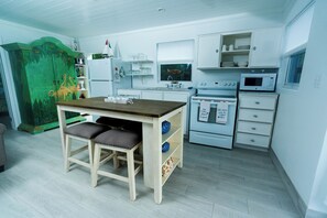Villa | Private kitchen | Full-size fridge, microwave, oven, stovetop